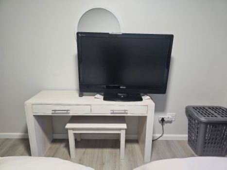 vanity area with mirror